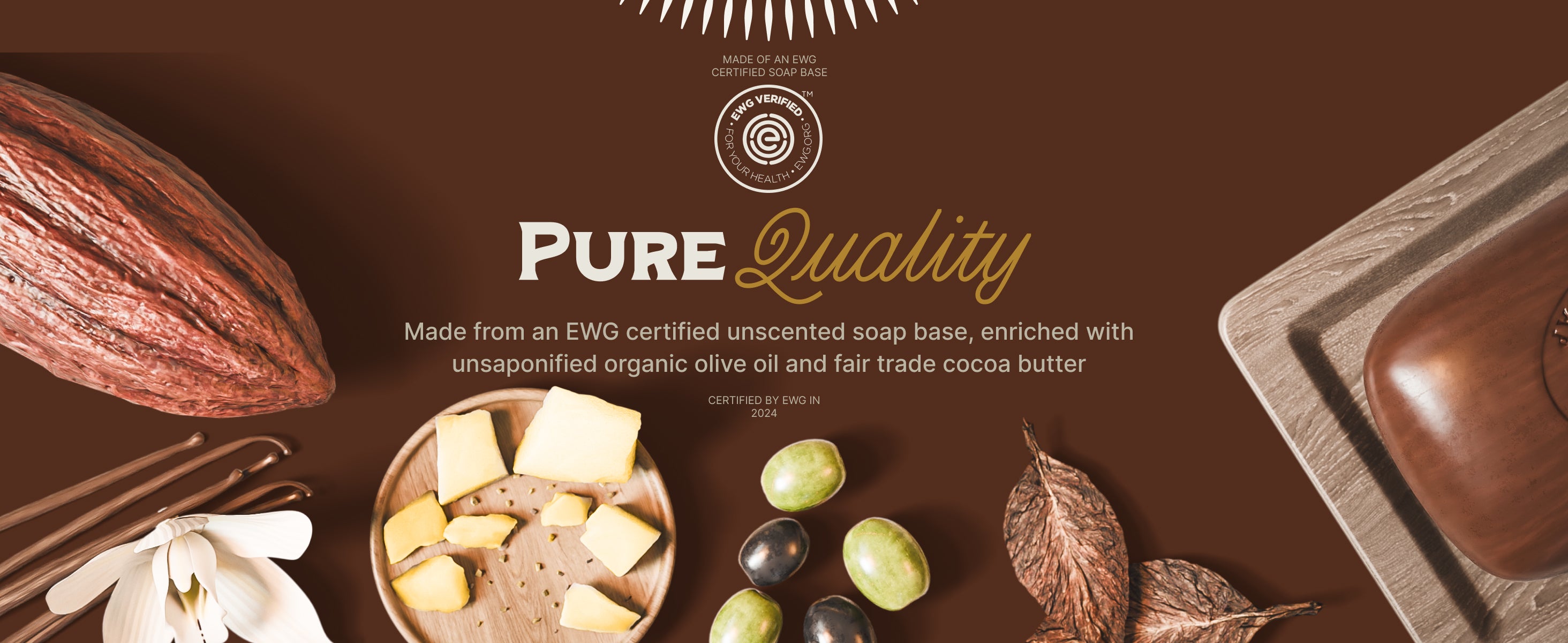 cocoa bean, coco butter and olives shown on brown background with a brown bar of soap sitting in soap tray. Graphics show an EWG verified logo and text stating "Pure Quality"  "made from an ewg ver